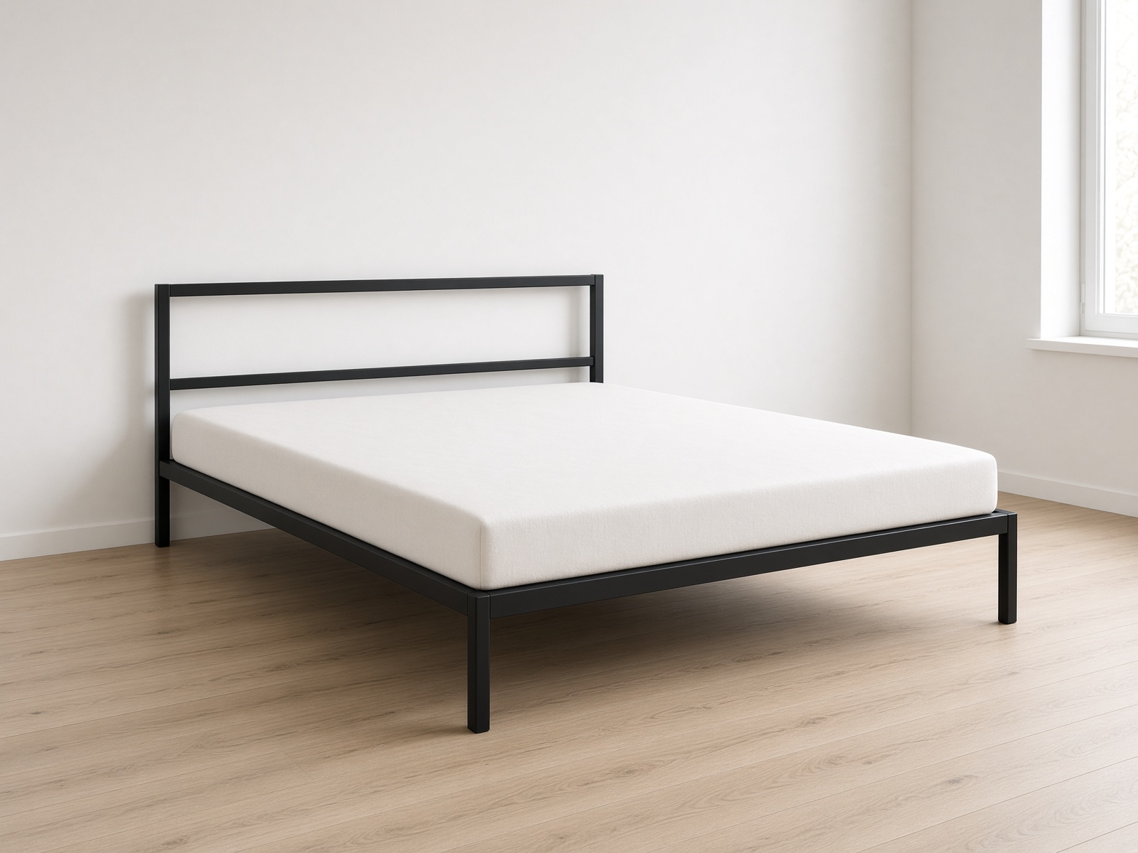 A black metal double bed with oatmeal linen.