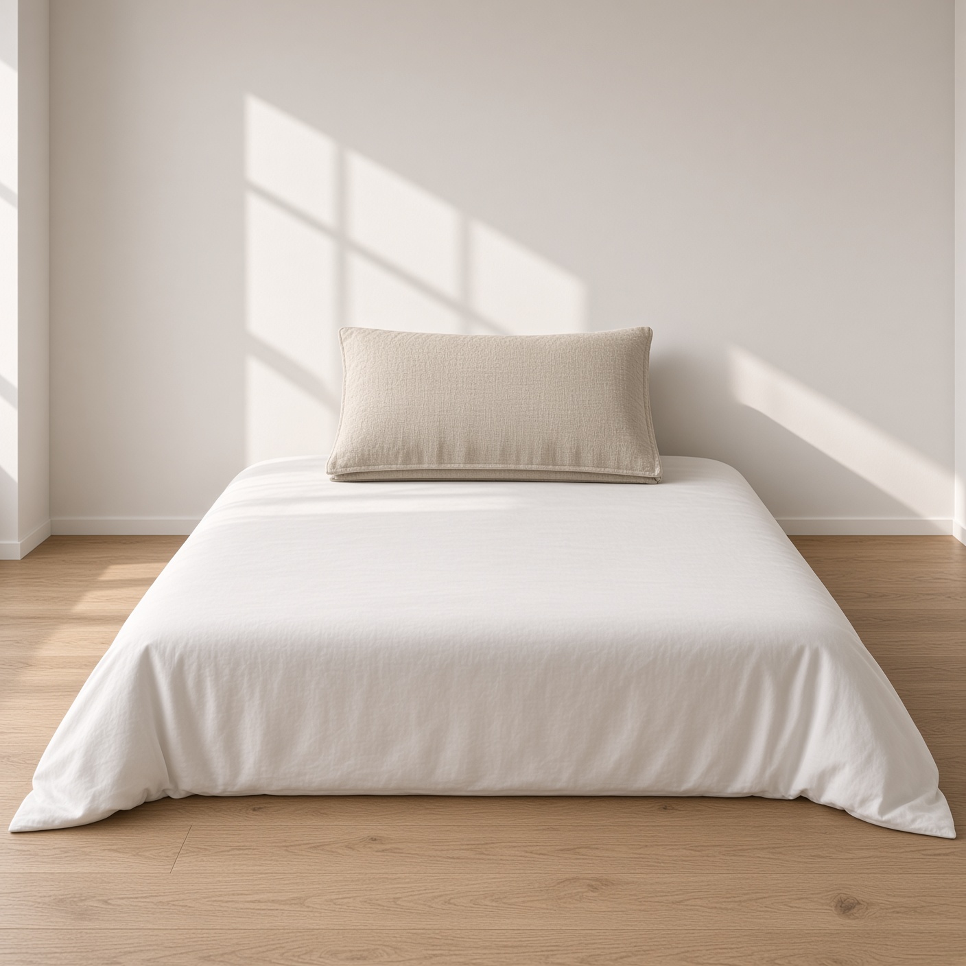 A folded oat linen pillowcase.